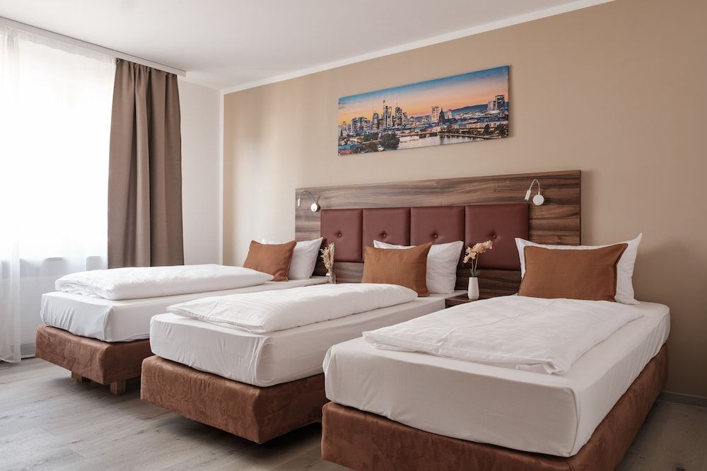 Bild von Deluxe-Dreibettzimmer