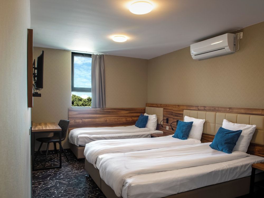 Bild von Deluxe-Dreibettzimmer